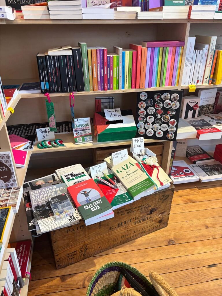 A donation box and solidarity items hosted by a bookshop